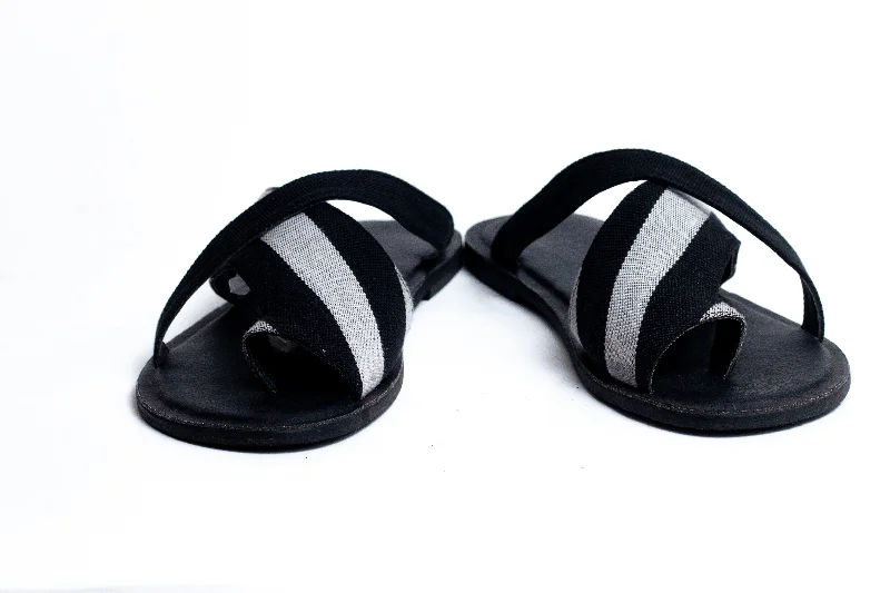 Men's sandals in a neutral color like black or brownAtona Black and White Criss-Cross Slippers