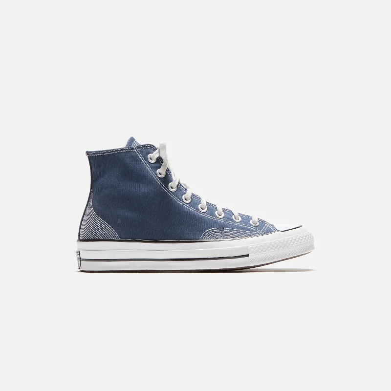 Men's navy blue suede sneakers with gold - toned eyeletsConverse Chuck 70 Multi-Stitch Cotton High - Navy / Fossilized